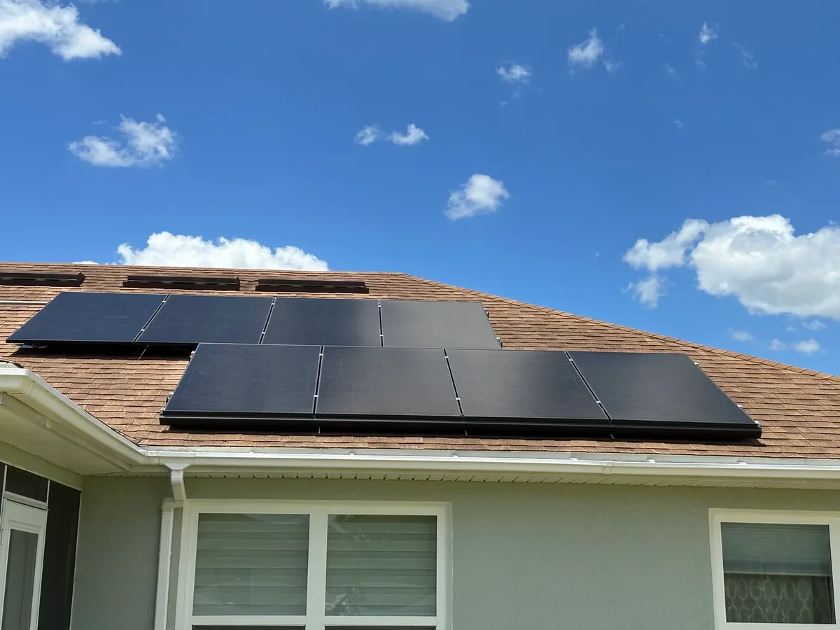 Solar panels installed by Sunstorm beneath a blue Florida sky