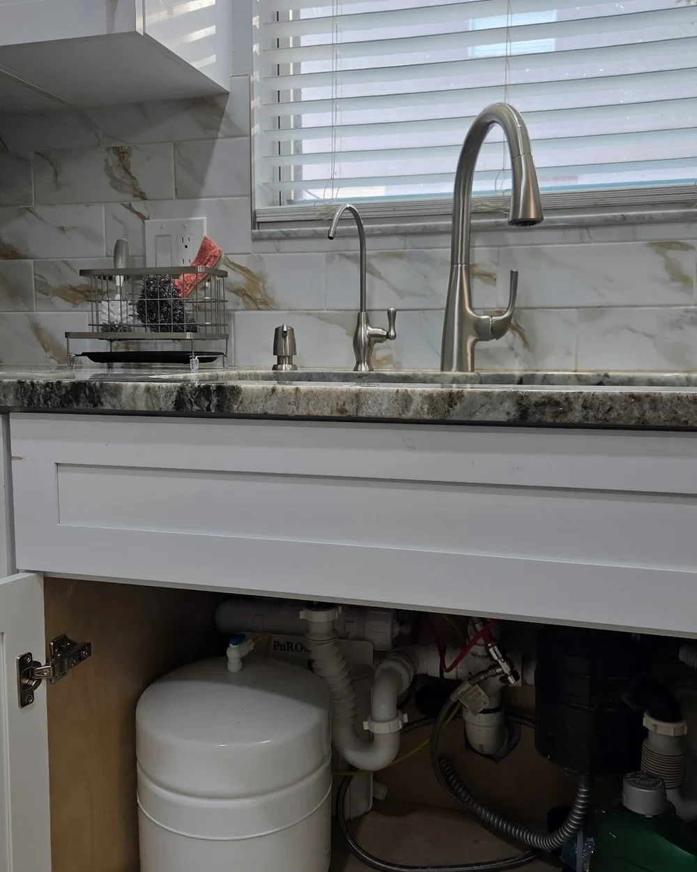 Brushed-nickel HydroSip RO™ drinking-water faucet with the under-sink reverse-osmosis storage tank visible below